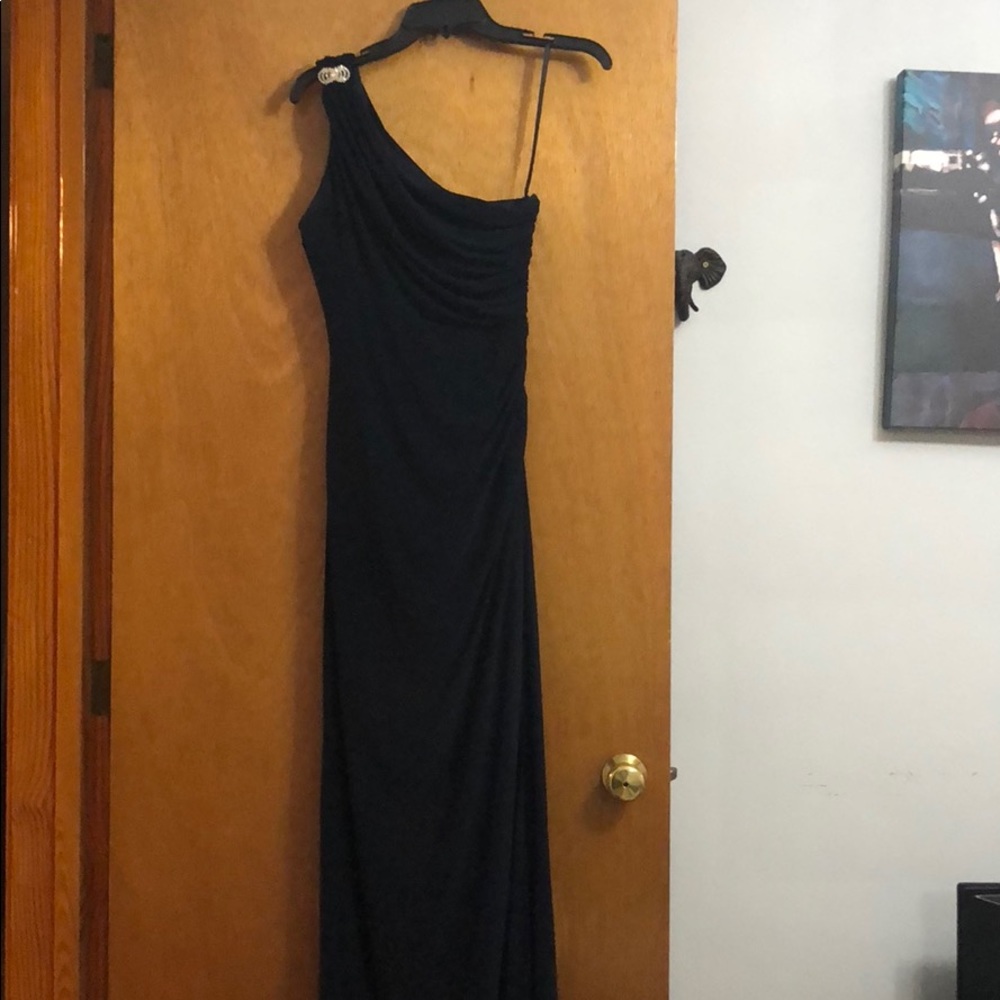 Navy full length gown with diamond brooch